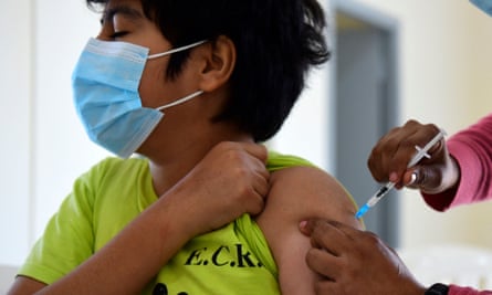 A minor receiving a Covid-19 vaccine in Asuncion, Paraguay. Pfizer and BioNTech have said trial results showed their coronavirus vaccine was safe and produced a robust immune response in children aged five to 11.