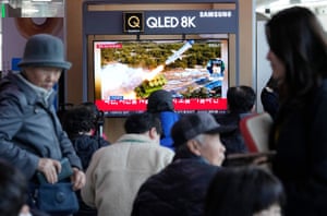 A TV screen shows a file image of North Korea’s missile launch during a news programme