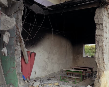 Desks in the destroyed school.