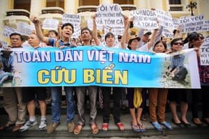 Protesters in Hanoi hold a banner saying ‘Vietnam people, save the sea’ at a rally against the government’s response to the toxic spill from the Formosa Ha Tinh steel plant.