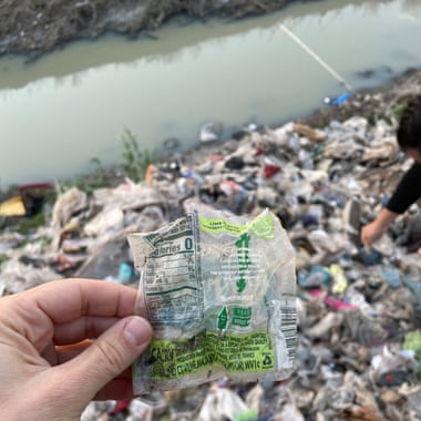 a hand holding a plastic bag