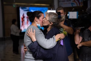 A mother and daughter embrace at Sydney international airport after the first passengers on quarantine-free flights landed in Australia.