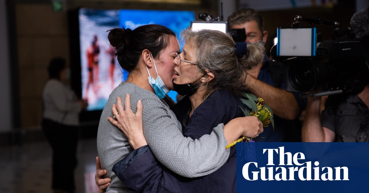 ‘I’ve got to get to my daughter, I’ve got to hold her’: families reunite at Sydney airport after international border reopens