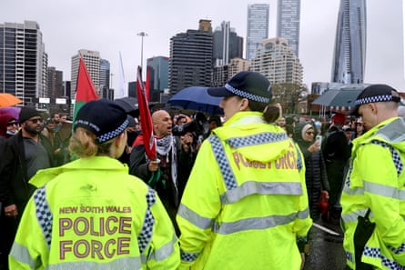 NSW Police officers stand in front of people demonstrating against Israel’s treatment of Palestinians in Gaza