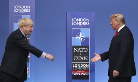Boris Johnson reaches out to shake hands with Donald Trump