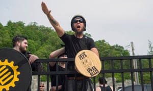 A white supremacist gives the Nazi salute