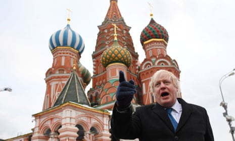 Boris Johnson stands in front of St Basil’s Cathedral during a visit to Red Square, in Moscow, Russia December 22, 2017