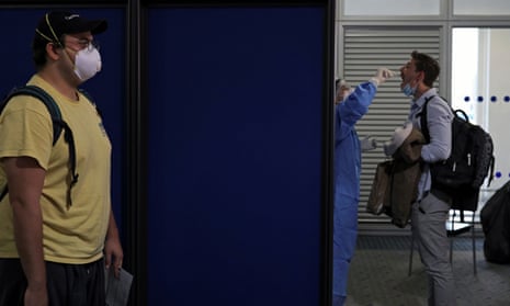 A passenger from a Lufthansa flight is tested for coronavirus at Athens airport.