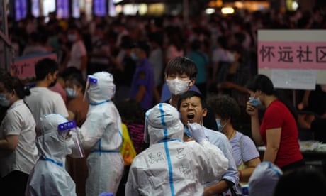 A resident gets tested for coronavirus in the Liwan District in Guangzhou 