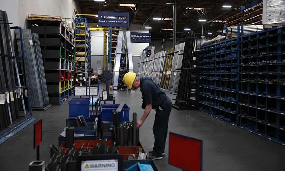 A worker looks through steel pieces at a metal supply business in Burbank, California.