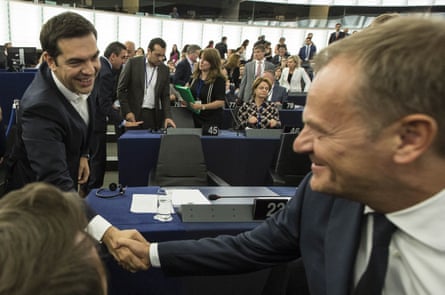 Greek prime minister Alexis Tsipras, left, shakes hands with Donald Tusk.
