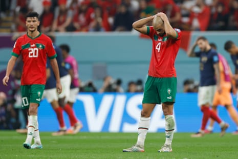 Sofyan Amrabat holds his head in his hands as the final whistle goes as Morocco go out.