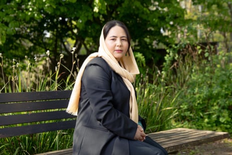 Zahra Joya poses for portrait on a bench in Elthorne Park, London.