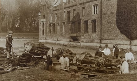 Workers dig out a moat at Oxburgh Hall, 1900-1910.