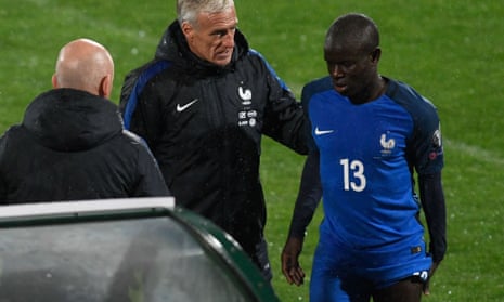 N’Golo Kanté feels his injured hamstring as he leaves the field during France’s win in Bulgaria, consoled by Didier Deschamps.