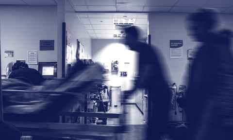 a trolley being pushed through a busy hospital