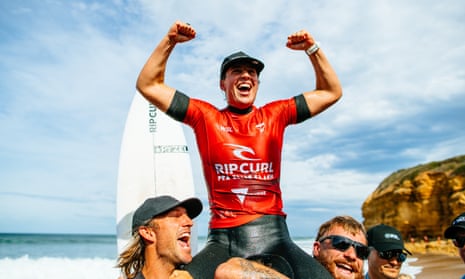 Australian Tyler Wright celebrates her Bells Beach triumph on the shoulders of her brothers, Owen and Mikey Wright.