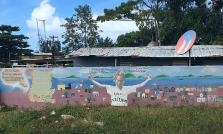 A mural local children have painted in a now vacant lot following an eviction in Vietnam.