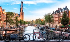 View of canal in Amsterdam, Holland. Amstel river, canal, and bicycles.