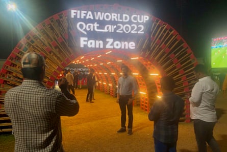Visitors to the fan zone for migrant workers in Doha, Qatar during an evening event.