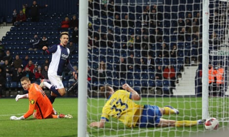 West Bromwich Albion’s Callum Robinson scores their first goal.