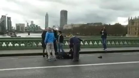 Members of the public helping the injured on Westminster Bridge – video 