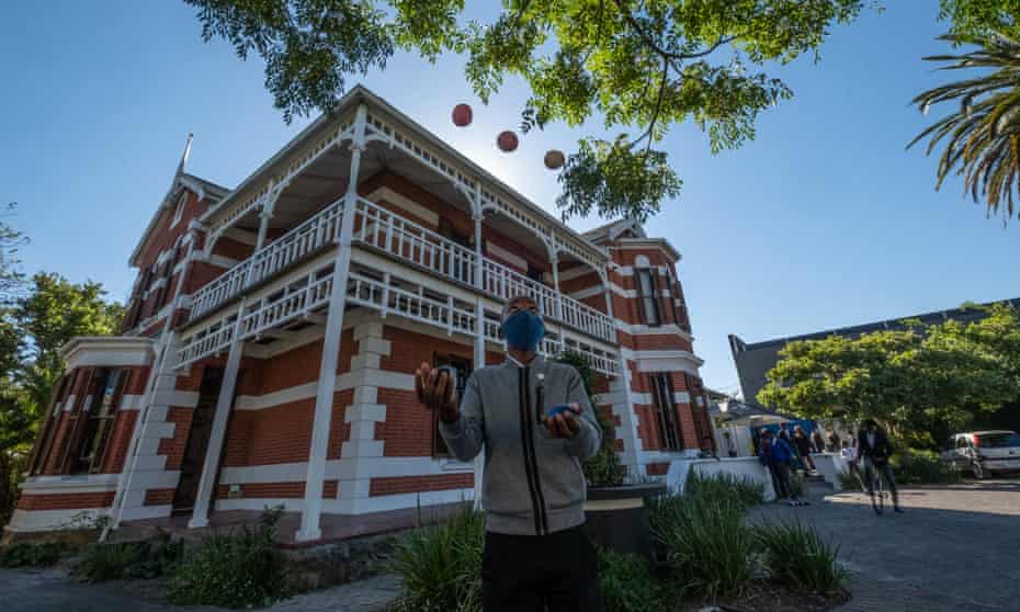 A student juggles outside the college.