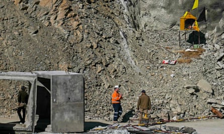 Rescuers near the mouth of the tunnel on Friday