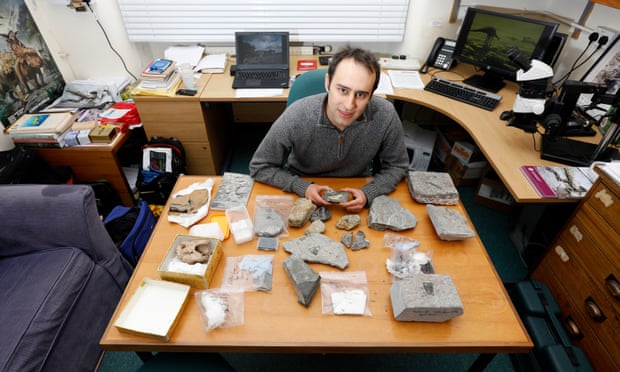steve brusatte at the finds table in his office