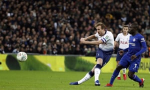 Tottenham’s Harry Kane thwacks the ball goalward.