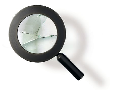 Magnifying glass with cracks across it and aits own shadow below