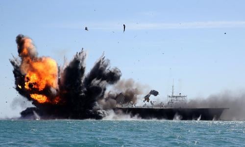 Iran's Revolutionary Guard attacks mock US aircraft carrier in naval drills | Iran | The Guardian