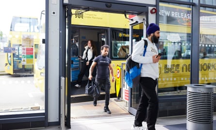 Bus passengers disembark at Bolton interchange.