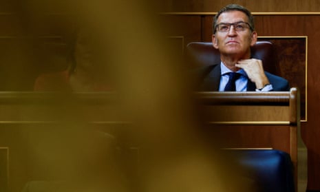 An investiture plenary session is held, in MadridSpain’s opposition People’s Party leader Alberto Núñez Feijóo looks on in parliament on the day of the investiture debate in Madrid, Spain
