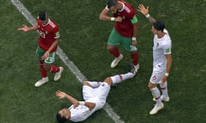 Portugal defender Pepe lies prone after feigning contact from Morocco defender Mehdi Benatia in the group stage game in Moscow.