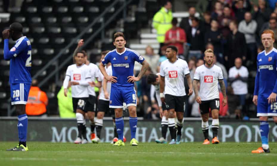 Dejected Brentford players during the recent defeat at Derby.