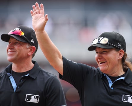 Umpire Jen Pawol waves to the crowd after a game between the Atlanta Braves and the Miami Marlins.