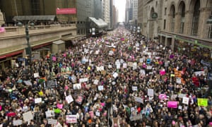 Massive crowds
march past Grand Central Station on 42nd Street.