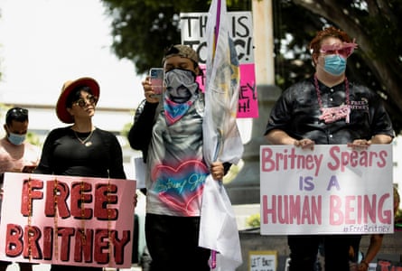 Supporters hold signs during a rally for pop star Britney Spears during a conservatorship hearing in Los Angeles, 27 April.