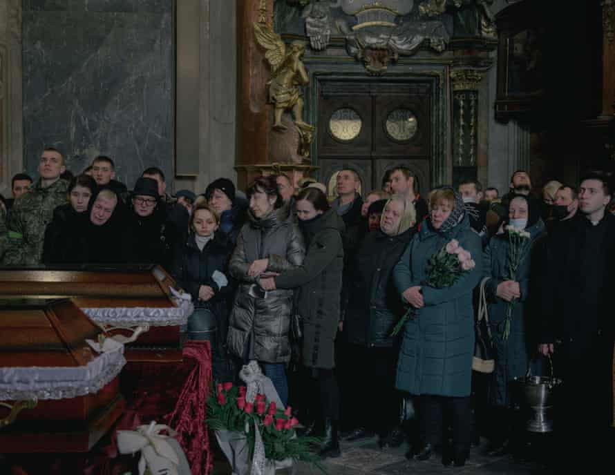 Relatives mourn three soldiers – Andriy Stefanyshyn, Taras Diduh and Dmytro Kabakov – during a ceremony at Saints Peter and Paul garrison church in Lviv, 11 March