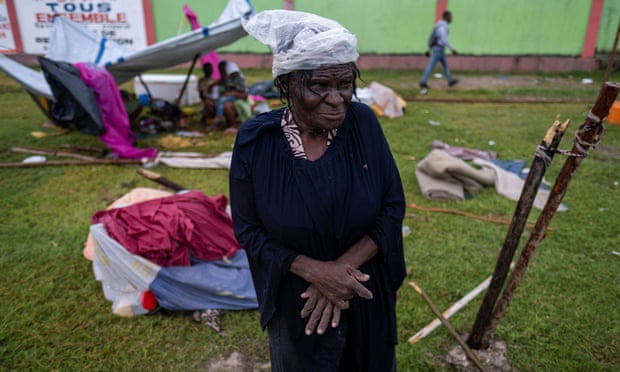 A woman looks on in a makeshift camp in Les Cayes, Haiti.