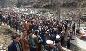 Funeral prayers beside the coffin of whistleblower Afzal Kohistani, who was killed by gunmen in March.