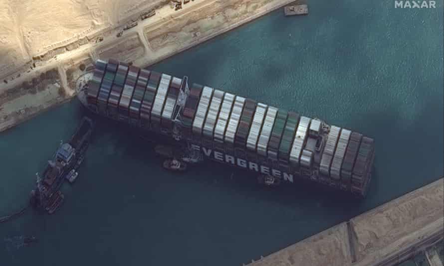 View from above the Ever Given vessel stopping on either side in the Suez Canal.