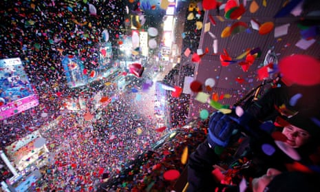 Confetti is dropped on revelers at midnight during New Year celebrations in Times Square, New York