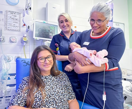 Amisha Adhia, Chineze Otigbah, baby Ishaani and another healthcare professional in a ward.
