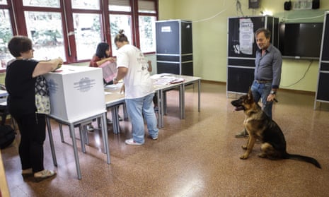 Italians vote at a polling station in Rome