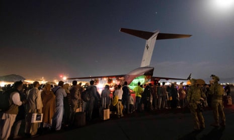 Evacuees board a Royal Australian Air Force C-17 in Kabul