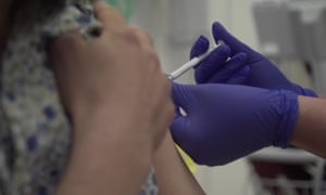 A person being injected as part of human trials in the UK for a coronavirus vaccine at the start of Oxford University vaccine trials, on 14 May.