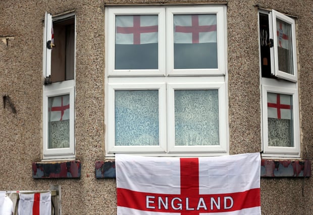 St George's cross flags hanging on the front of a house