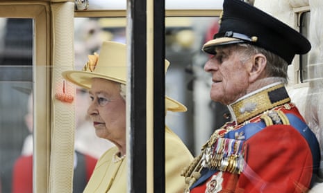 Prince Phillip sits beside Queen Elizabeth II in 2011.